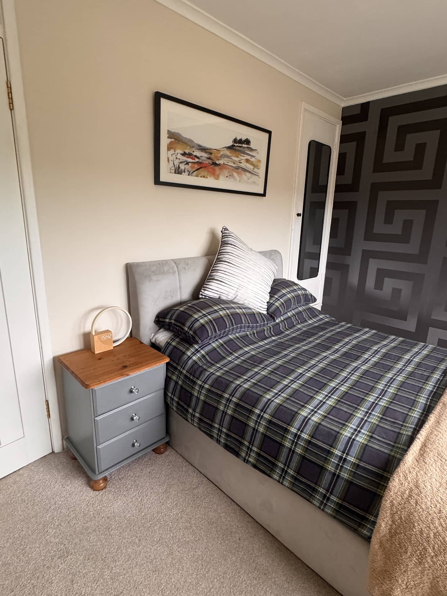 Double bed with bedside table and lamp